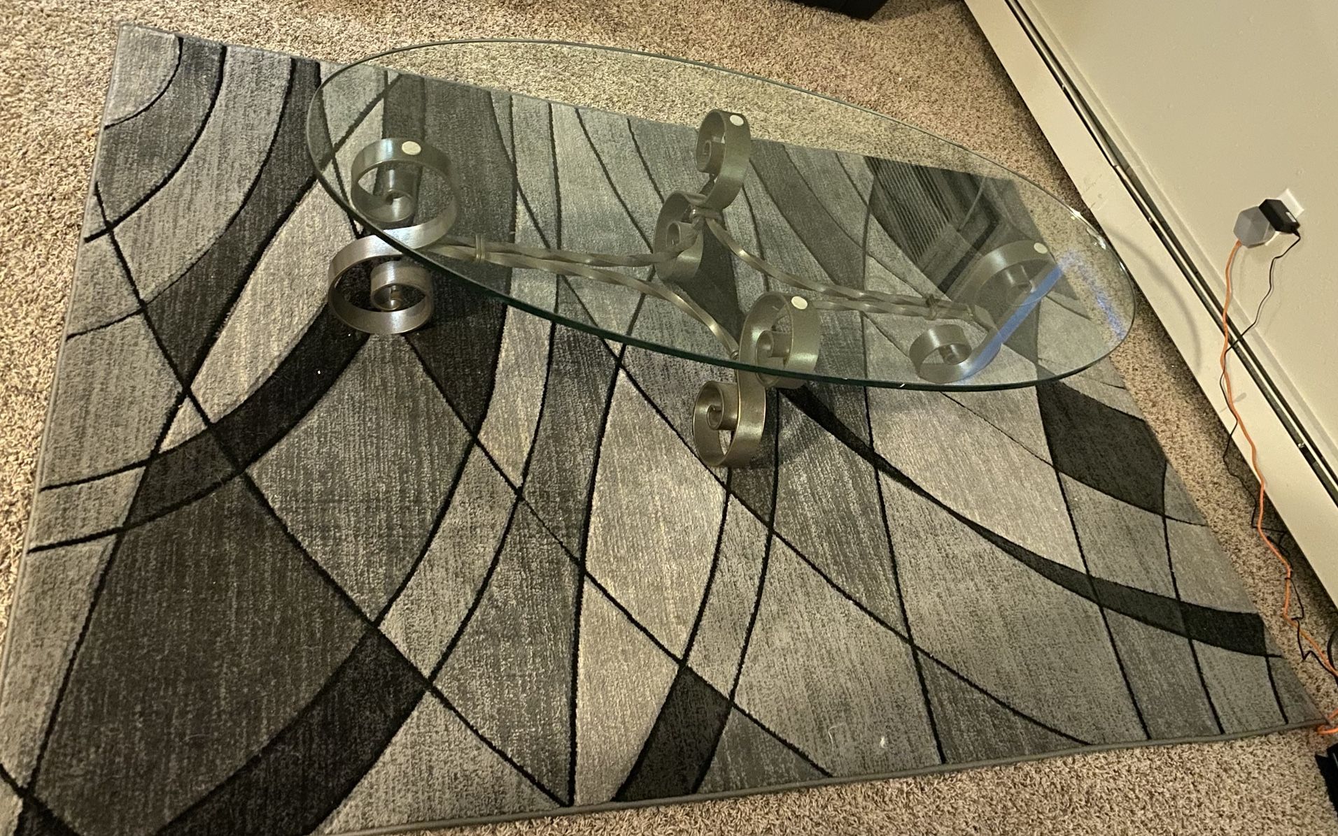 GLASS COFFEE TABLE AND RUG FOR SALE.