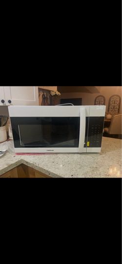 Brand new Frigidaire over the range microwave has a small dent in back please refer to pictures but everything works perfect