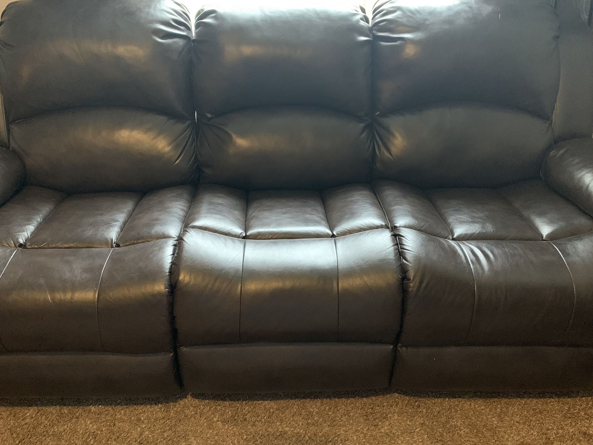 Leather Reclining couch and loveseat
