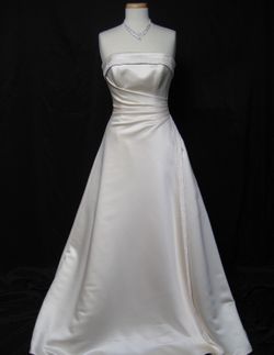 Maggie Sottero Couture Wedding Dress with matching clutch and veil