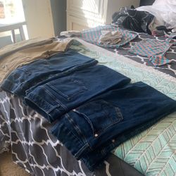 Four Pairs Of Straight Legged Jeans And One Wide Legged Khaki Pants, A Total Of Five Pair Sizes 9 to 12 barely worn probably didn’t even wear them one