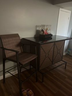 Indoor out door bar ..glass top..  2 chairs