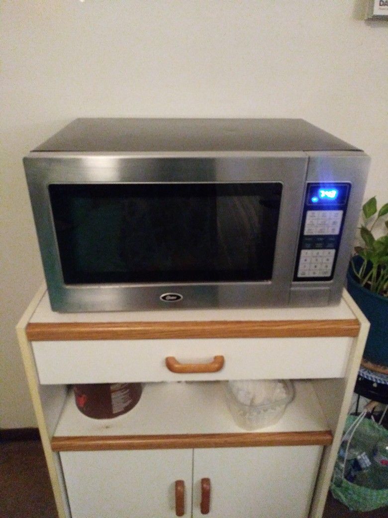 Black and Silver Microwave Medium Size Oster Brand