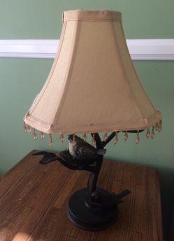 Hey beautiful table top lamp beautiful brown metal and I shared with tassels