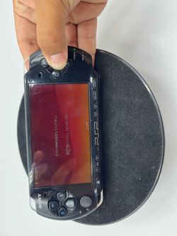 PSP 3000 with no battery cover and a bad O button