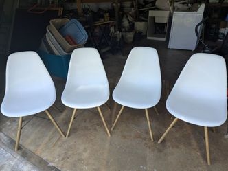 4 white armless plastic kitchen/dining chairs