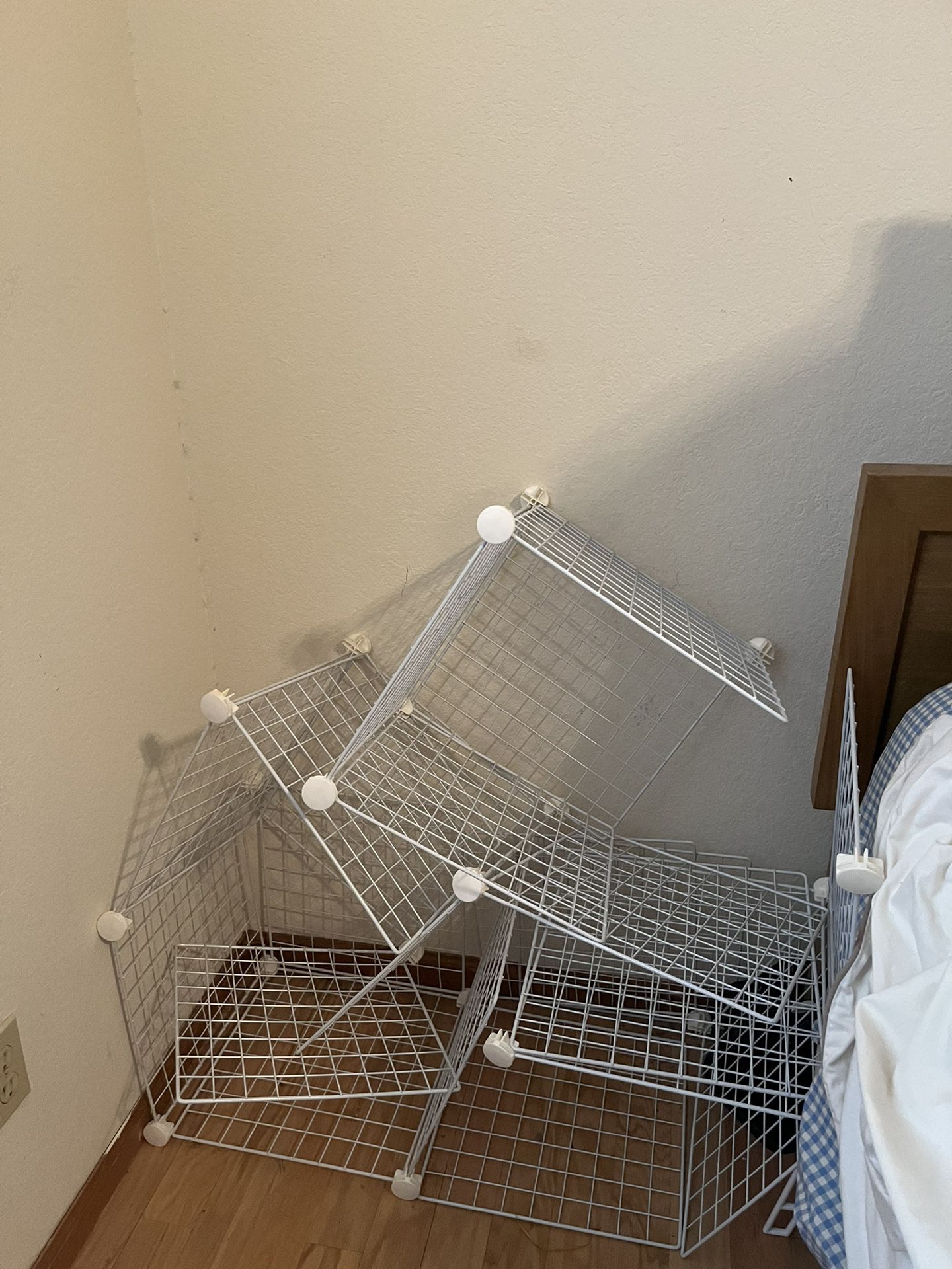 white metal cube storage rack that needs to be assembled 