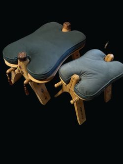 A pair of vintage hand-carved wooden camel saddle footrests.