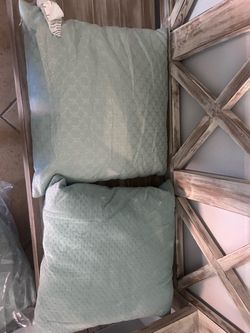 4 teal throw pillows