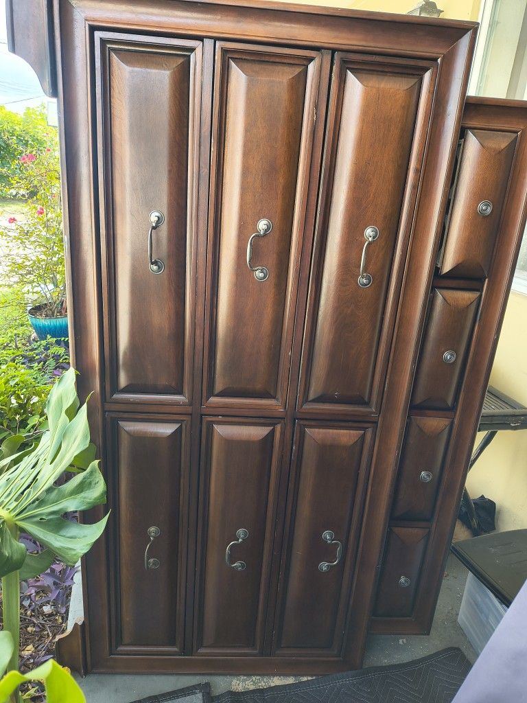traditional dark wood dresser or chest of drawers.