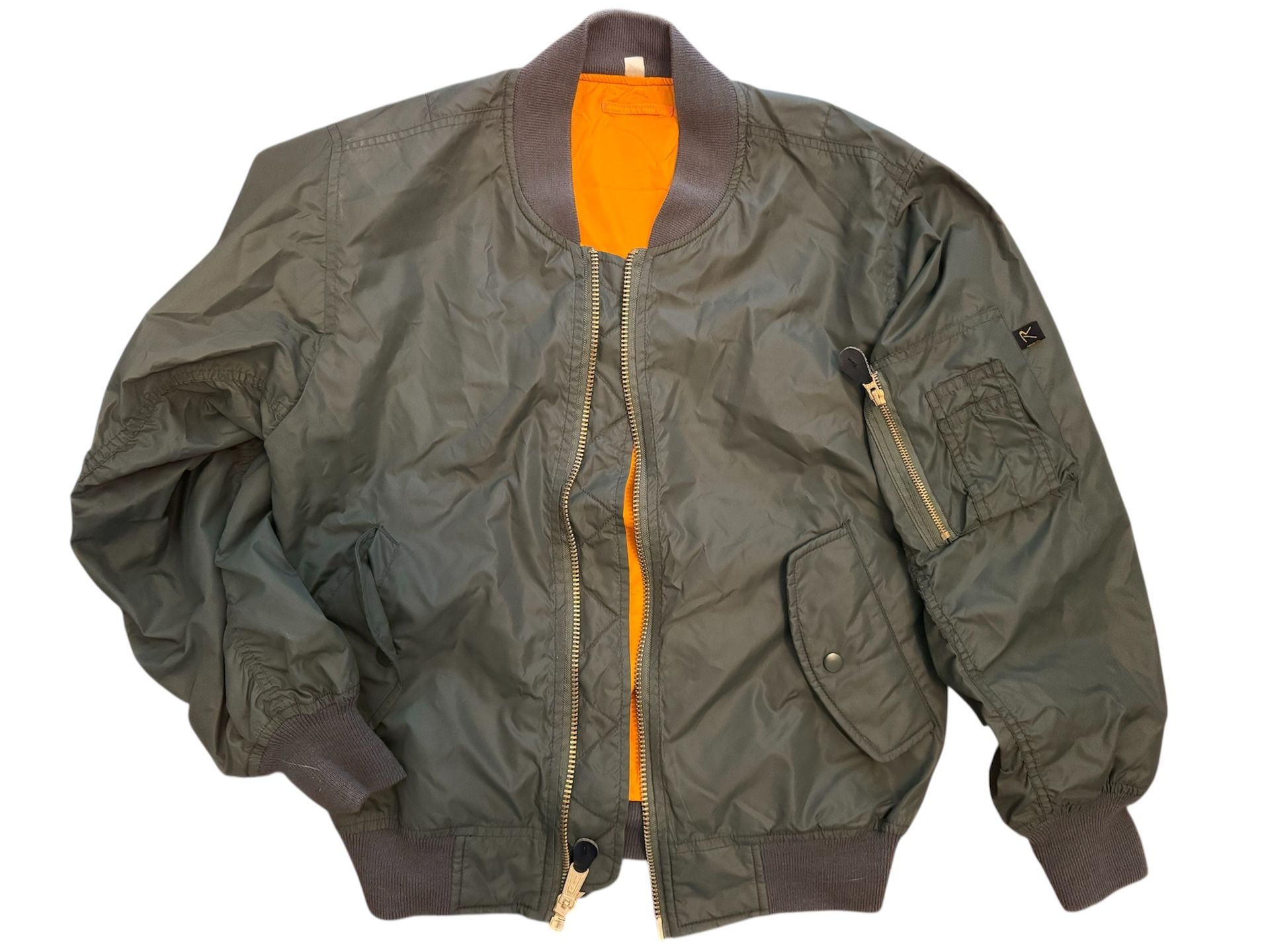 Classic MA-1 flight jacket with reversible orange polyester lining.