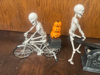Skeleton riding a bike