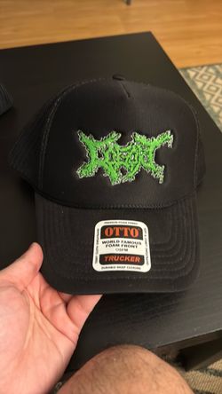Black Otto Trucker Hat with Green Embroidered Logo