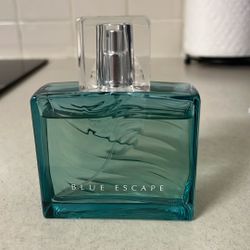     Blue Escape Cologne Bottle – Good Condition