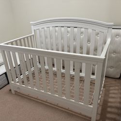 White Delta Children 6-in-1 Convertible Baby Crib