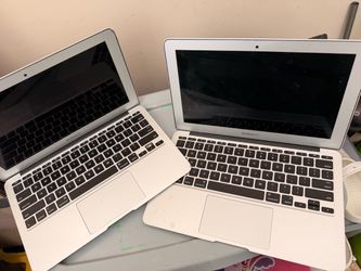 Two Apple lap tops