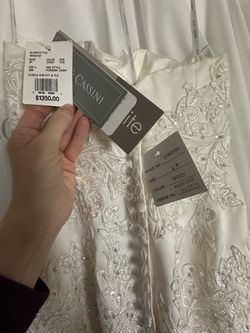 Brand new trumpet style beaded wedding gown
