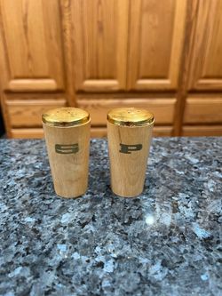 Vintage  Mid Century Napco Teak Wood With Metal Top Pair of Salt and Pepper Shakers.  Size approximately 2 1/2 inches tall.  Preowned never used.