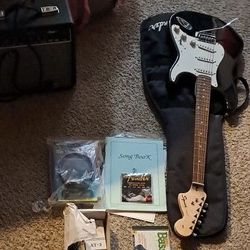 Squier Strat Electric Guitar With Squier Champ 15 Amp And Tuner Etc