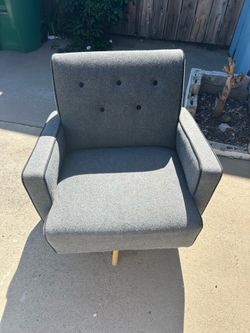 Gray tufted swivel accent chair -  Noble House Deborah model featuring a mid-century modern design