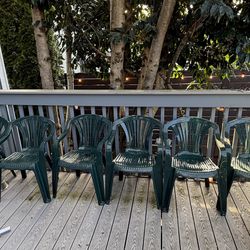 6 green plastic chairs