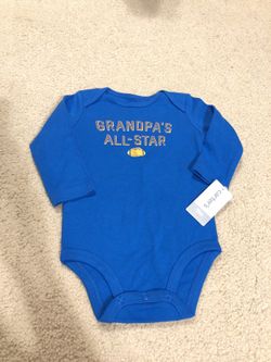 BRAND NEW: Carter’s onesie in size 9 Months