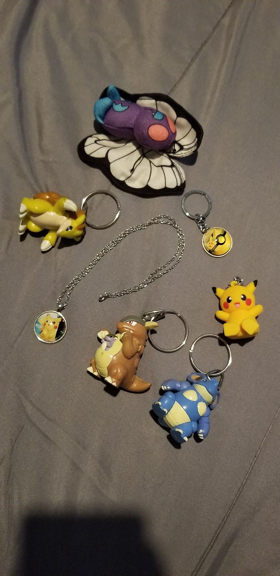 5 pokemon key chains, 1 necklace, I plushy