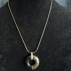 Gold Tone Necklace with Black Circular Pendant
