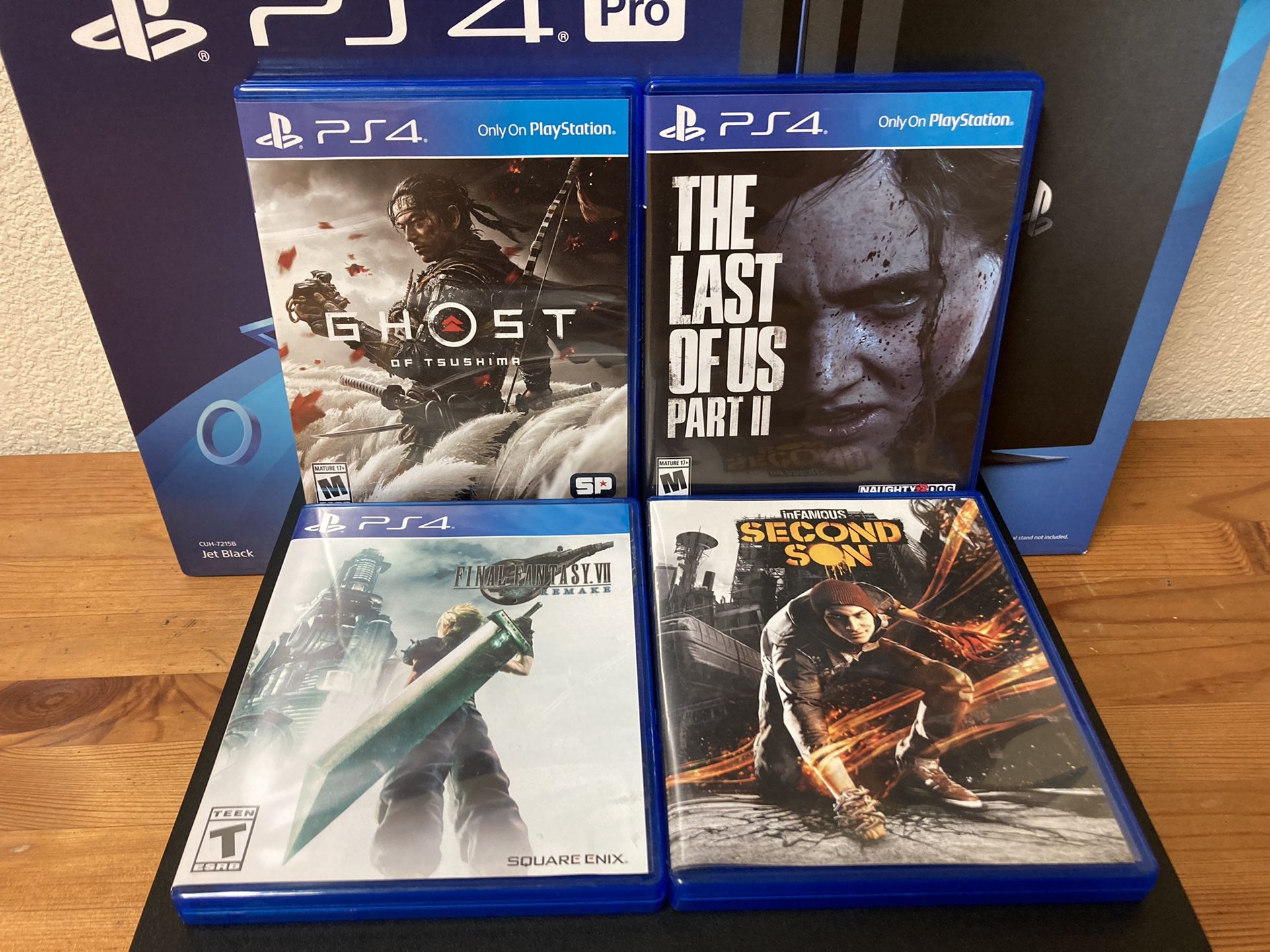 PlayStation 4 Pro With 4 Games, Dual Shock 4 Controller And A Charging Dock