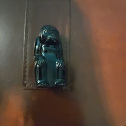 novelty lighter, specifically a vintage G.E.I. butane lighter shaped like a gorilla.
