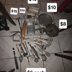 Vintage kitchen utensils, meat hammer, potato smasher, rolling pin, green rotary telephone, nut chopper, syrup pitcher & aluminum bread pan.
Pick up i