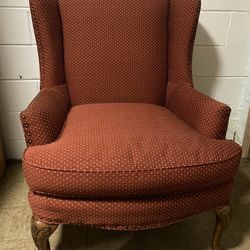 Vintage HAVERTYS Comfortable Brick Red Queen Anne Style Armchair with raised Claw Foot wooden legs.  Good pre-owned condition. The top of the back whe