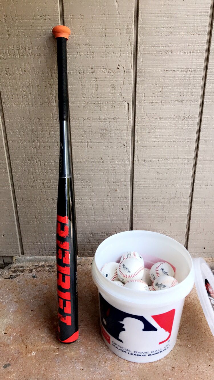 Brand new “EASTON REBEL” softball bat with a bucket of 24 major league baseballs to go with!