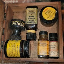 Collection of vintage bottles and jars, likely from the early 20th century