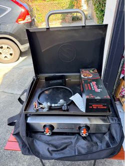 Blackstone 22 inch Portable Griddle with tools and table.