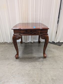Traditional Dark Wood End Table with Carved Details