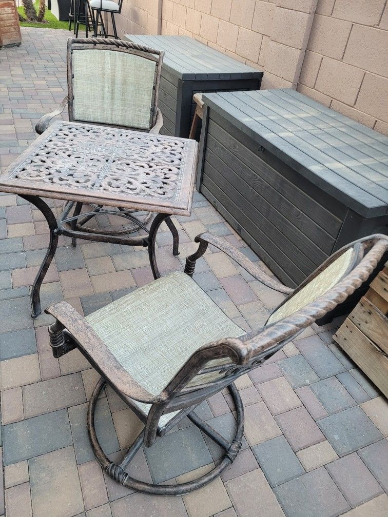 Metal Table/ 2 Swivel Rocker Chairs