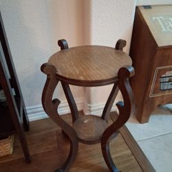 Antique carved oak two-tier plant stand or side table.