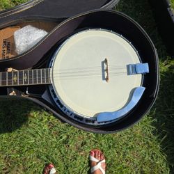 vintage Hohner 5-string banjo with a hardshell case. 