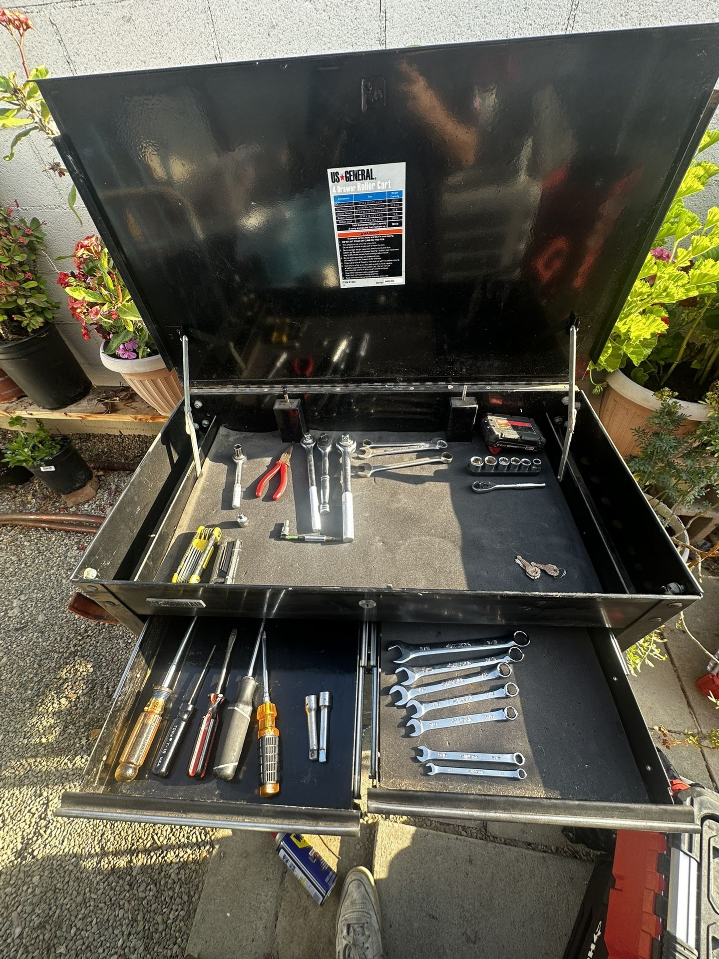 US general tool box with some tools