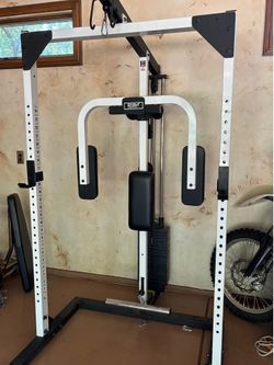 Tuff Stuff rack with weighted pec fly attachment