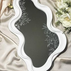 Engraved mirror