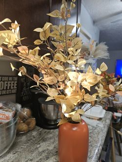 Ceramic orange Vase with dogwood stems