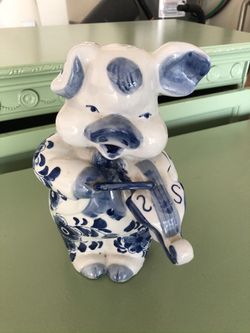 Porcelain piggy bank with decoration
