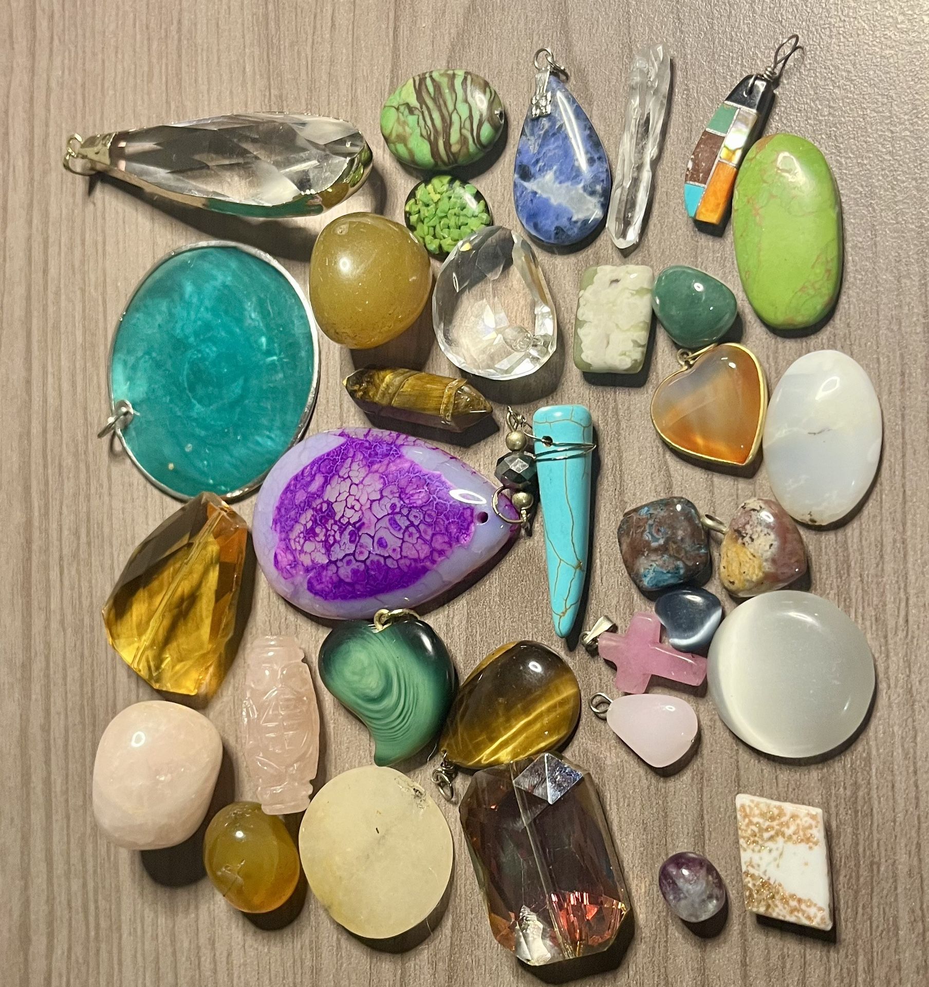 Pretty stones, pendants and trinkets. All different colors and sizes. As is. No returns. Make me an offer I can’t refuse. Please feel free to ask any 