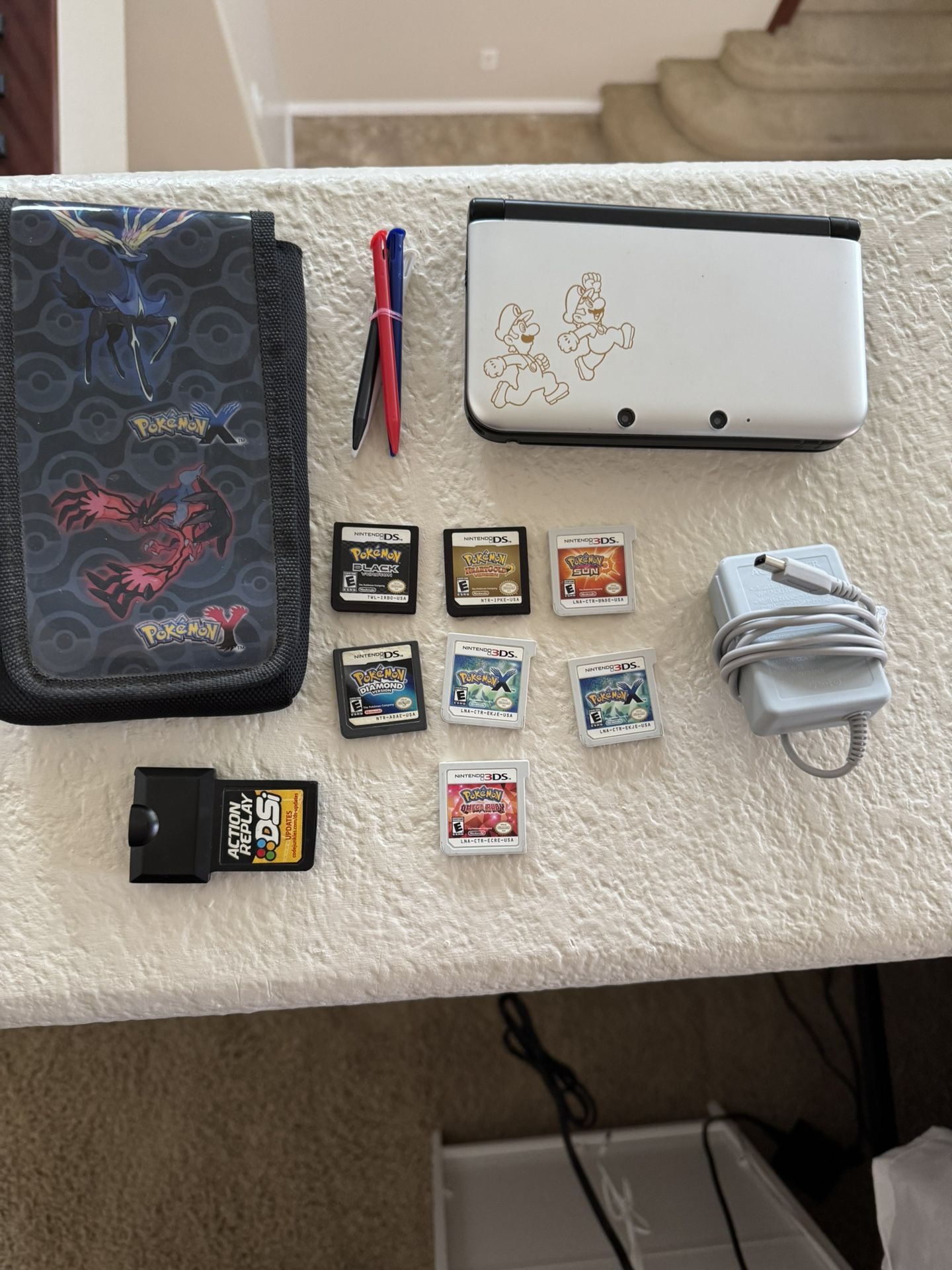Nintendo 3DS XL (Year of Luigi) with Pokémon Games