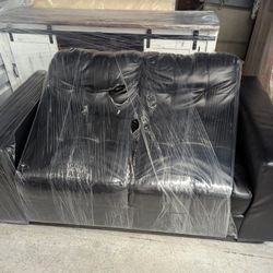 Small black couch/loveseat
The couch is about 59x35 
From the floor to the top of the seat is about 16 and 1/2 in 
From the floor to the top of the ba