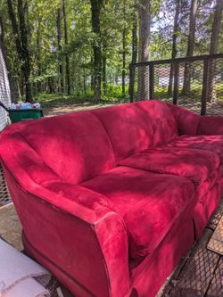 Red sofa. 87 inches wide $45