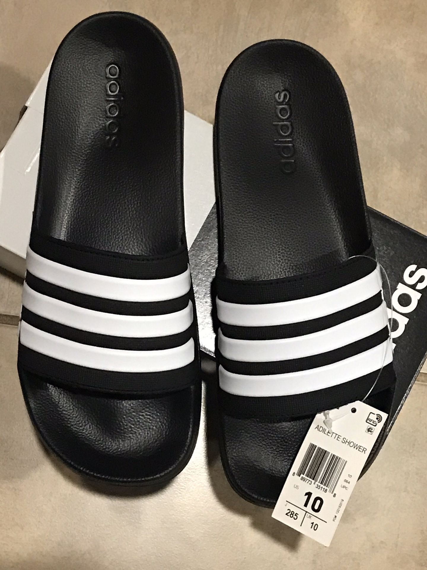 Brand new Adidas Slides Size 10 men’s