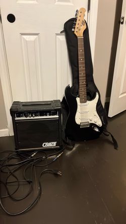 Electric guitar with new strings and a new crate amp